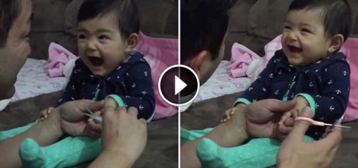 Adorable baby pretends to cry as dad cuts her fingernails